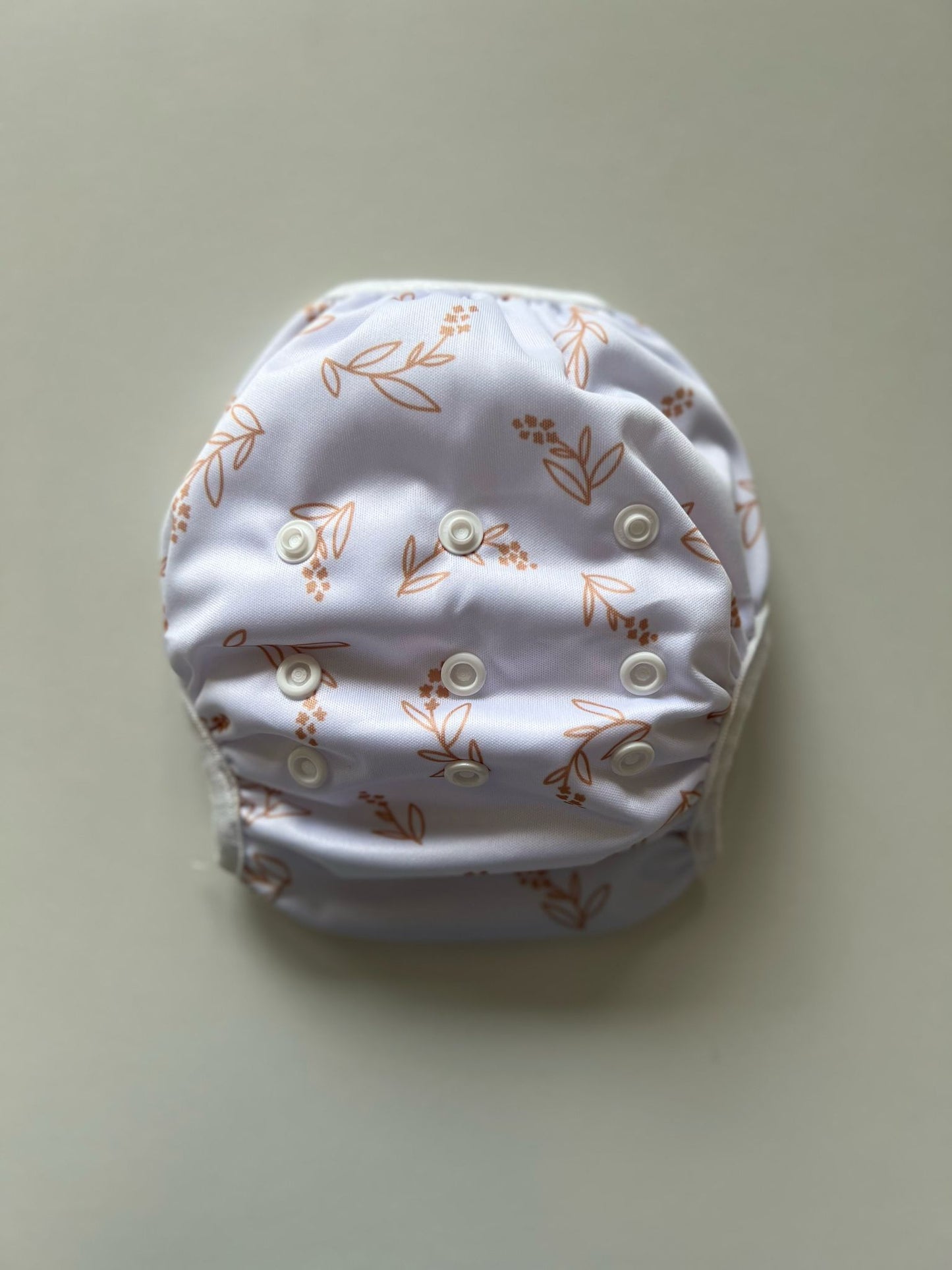 Wasbare zwemluier Bladgoud design