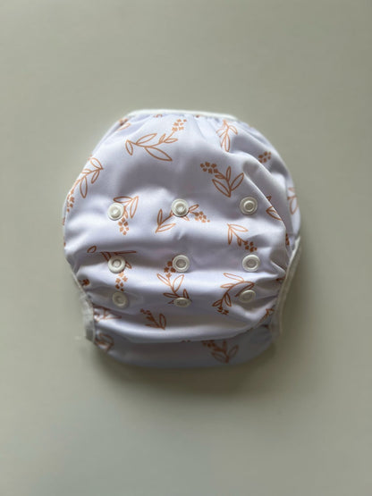 Wasbare zwemluier Bladgoud design