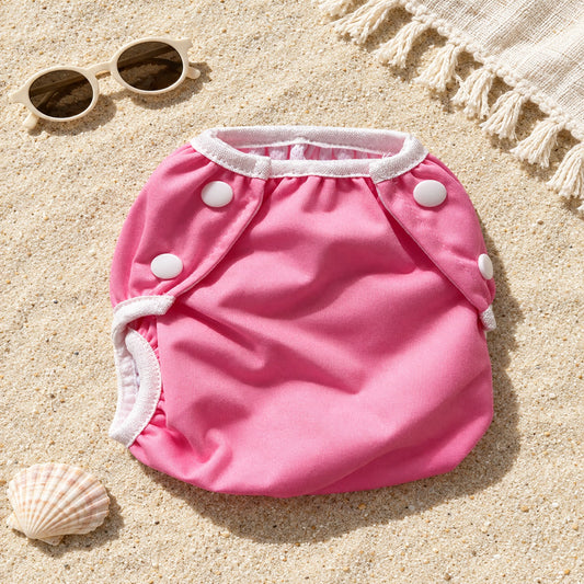 Wasbare zwemluier Roze effen design – strand flat-lay